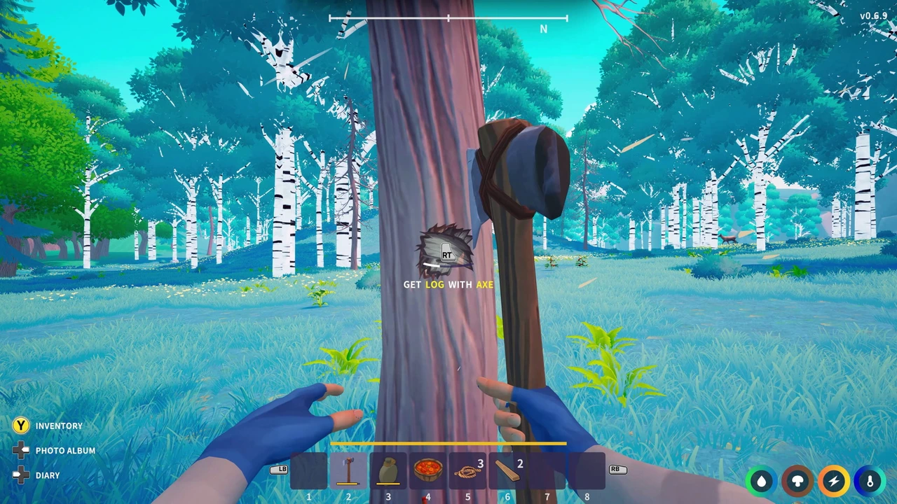 First-person view of a stone axe beside a tree, with a prompt to gather a log and survival meters below.